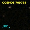 COSMOS J095747.99+014027.3