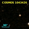 COSMOS J095747.46+015603.4