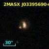 2MASX J03395690+1056322